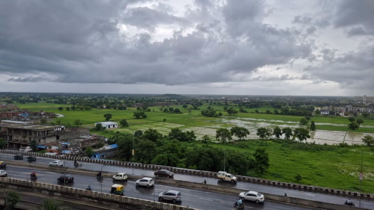 Stormy Highway Over Green Fields